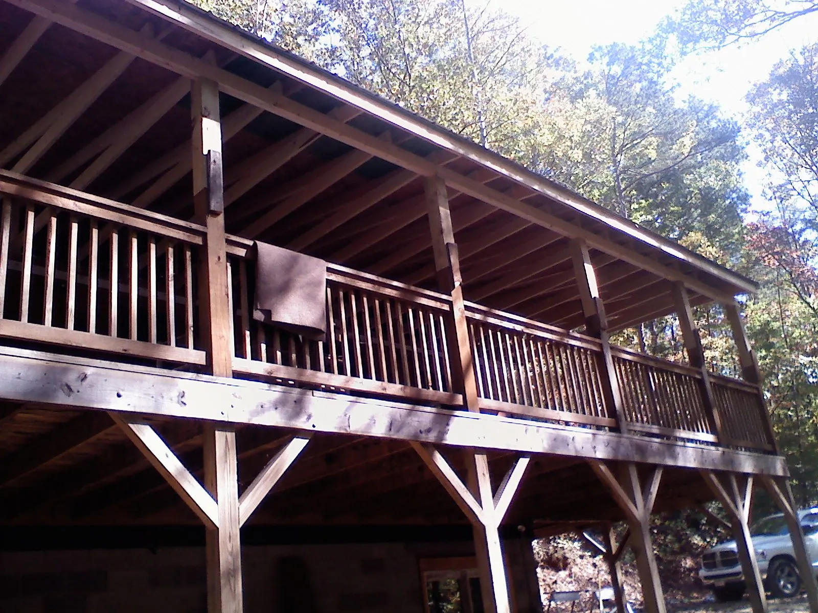 Timber framing under a new elevated porch and deck — Roof Leak Repair in Le Roy by Roofing Brothers